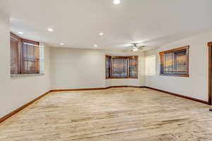 Empty room featuring light hardwood / wood-style floors and ceiling fan