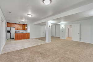 Interior space featuring pendant lighting, sink, light wood-type flooring, and stainless steel appliances