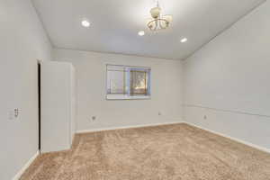 Spare room featuring carpet flooring