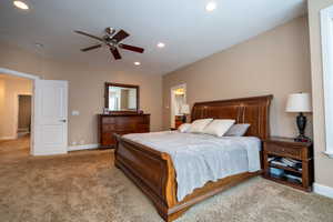 Primary bedroom featuring ceiling fan