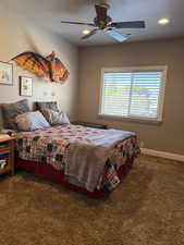 Carpeted bedroom with ceiling fan