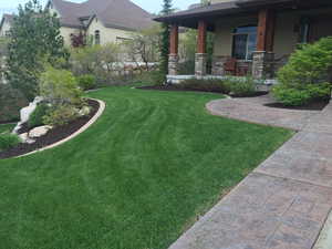 Summer View of yard with covered porch