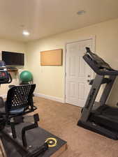 Exercise room with carpet flooring