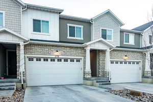 View of front of property featuring a garage