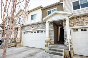 Property entrance featuring a garage