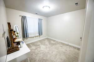 Interior space featuring a textured ceiling