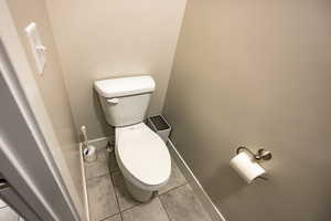 Bathroom with tile patterned floors and toilet