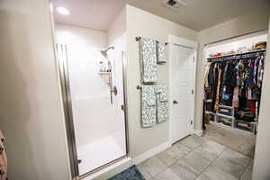 Bathroom featuring a shower with shower door