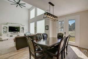 Dining area featuring ceiling fan and light hardwood / wood-style floors