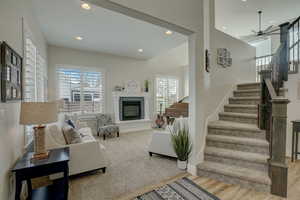 Living room featuring hardwood / wood-style floors and ceiling fan