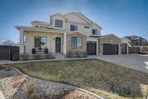 View of front of home featuring a front lawn and a porch