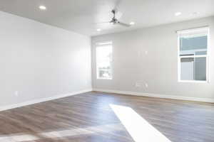 Unfurnished room featuring ceiling fan and hardwood / wood-style floors