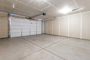 Garage featuring a garage door opener