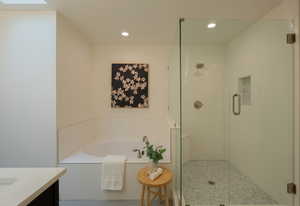 Bathroom with vanity and independent shower and bath