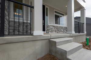 Property entrance featuring covered porch