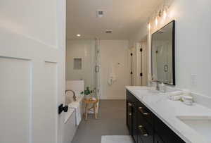 Bathroom with vanity and an enclosed shower