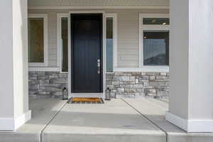 Property entrance featuring a porch