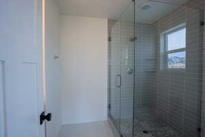 Bathroom featuring tile patterned floors and walk in shower