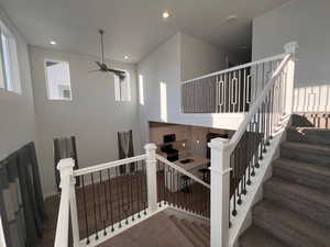 Staircase with ceiling fan and sink