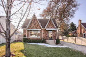 Tudor house featuring a front yard