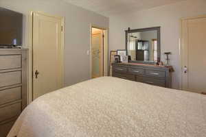 Bedroom featuring a textured ceiling