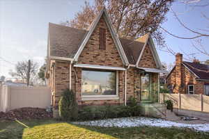 Tudor house with a front yard