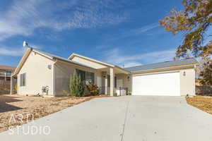 Single story home featuring a garage