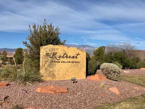 Community sign with a mountain view