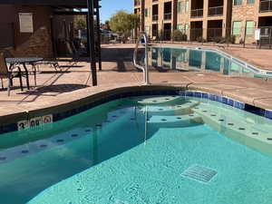 View of swimming pool featuring a patio