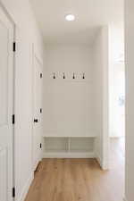 Mudroom with light wood-type flooring