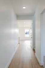 Hallway featuring light hardwood / wood-style floors