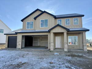 Craftsman inspired home featuring a garage