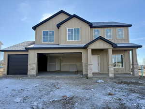 Craftsman house with a garage