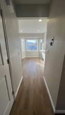 Corridor featuring hardwood / wood-style flooring