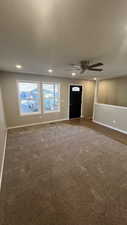 Interior space with ceiling fan and wood-type flooring