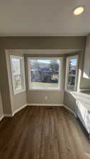 Unfurnished room featuring hardwood / wood-style flooring