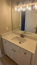 Bathroom with vanity and tile patterned floors