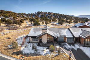 Birds eye view of property with a mountain view