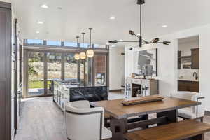 Dining room with sink and light hardwood / wood-style floors