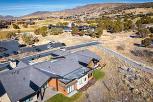 Birds eye view of property with a mountain view