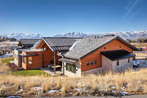 Back of house with a mountain view