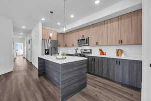 Kitchen has plenty of storage and countertop space along with a walk in pantry