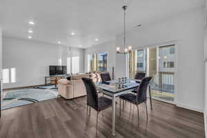 Dining area with chandelier and balcony