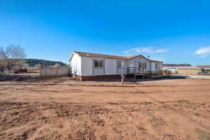 View of front of home with a deck with mountain view