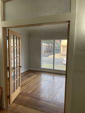 Empty room featuring wood-type flooring