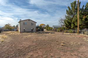 View of yard with a wooden deck