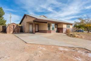 View of front of property with a storage unit