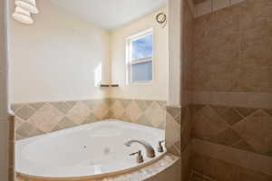 Bathroom with tiled bath