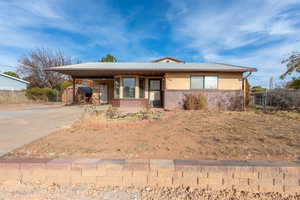 View of front facade featuring a carport