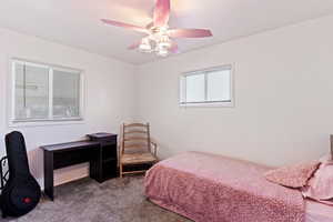 Bedroom featuring carpet flooring and ceiling fan